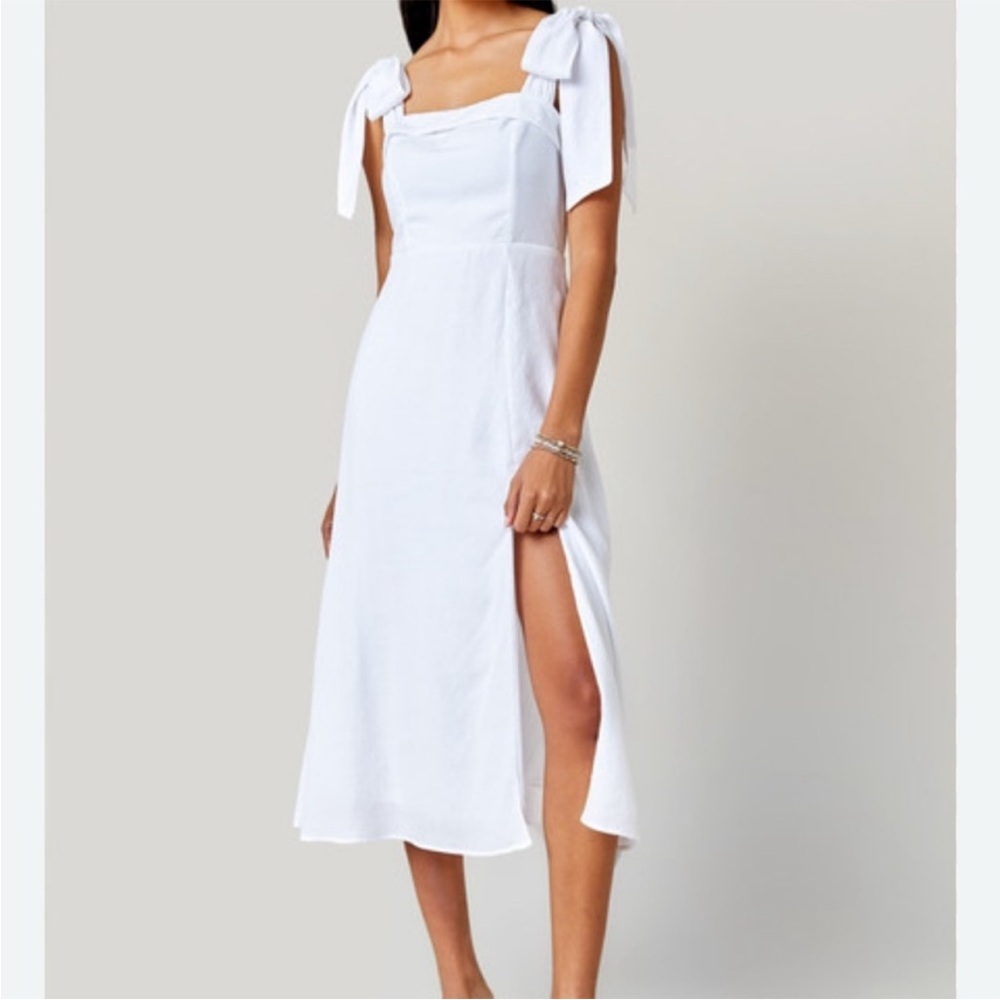 Francesca’s White Dress with slit on left leg.